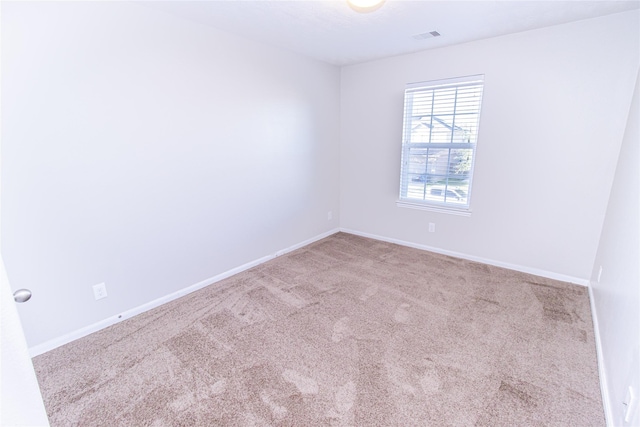 empty room featuring light colored carpet