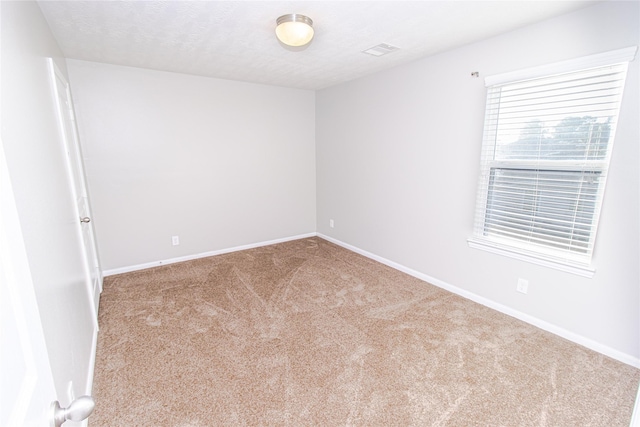 spare room with carpet floors