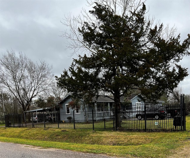 view of front of house with a fenced front yard and a front yard