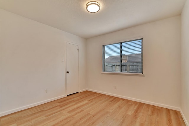 spare room with light wood-type flooring