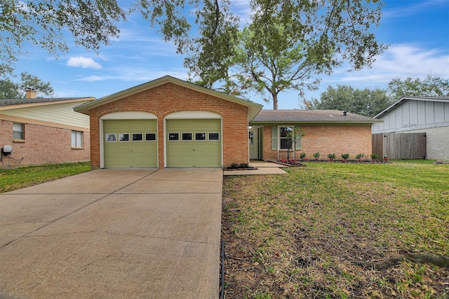 single story home featuring a garage and a front lawn