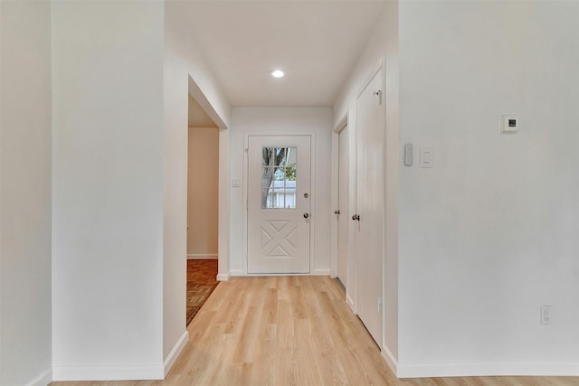 doorway to outside with light wood-type flooring