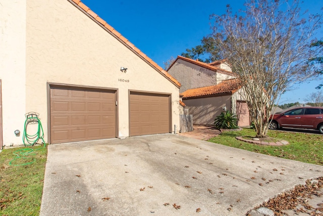 view of side of home featuring a garage