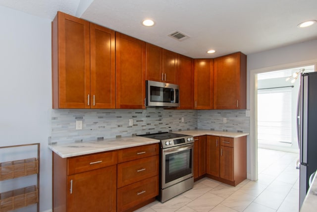 kitchen featuring backsplash and stainless steel appliances