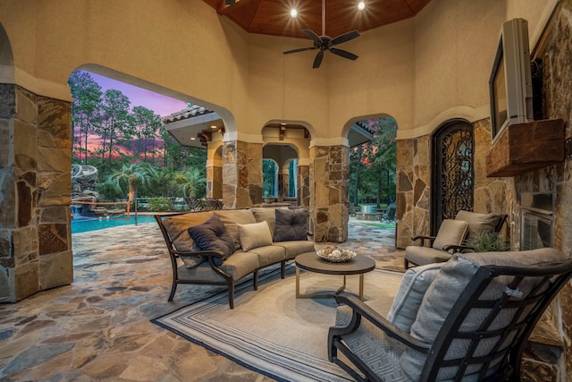 28322 Meadow Frst, Magnolia, TX 77355 - view of patio featuring an outdoor living space with a fireplace, ceiling fan, and an outdoor pool