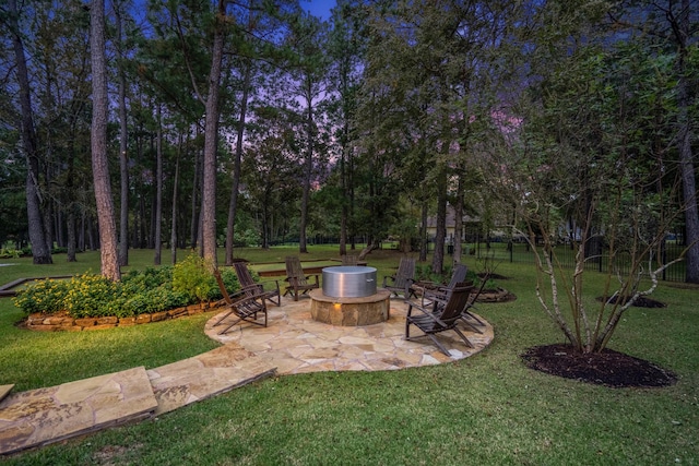 28322 Meadow Frst, Magnolia, TX 77355 - view of grassy yard with a fire pit and a patio