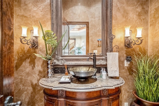 bathroom with vanity and crown molding