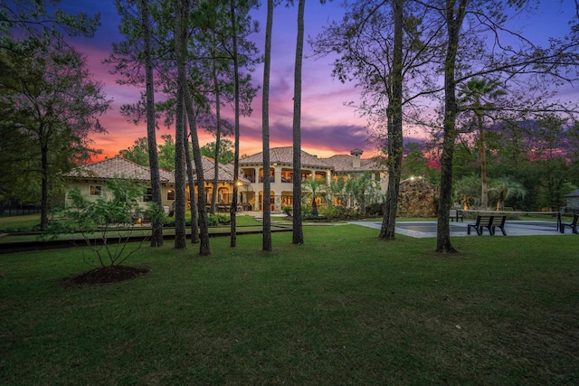28322 Meadow Frst, Magnolia, TX 77355 - yard at dusk with a lawn