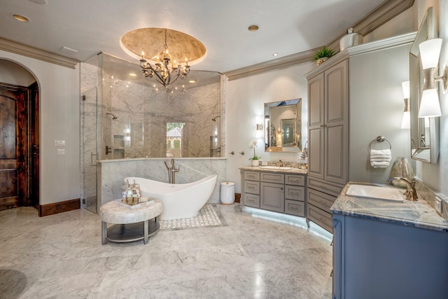 28322 Meadow Frst, Magnolia, TX 77355 - bathroom with walk in shower, two vanities, a freestanding bath, a chandelier, and marble tiled floors