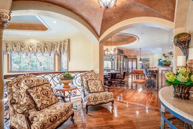 28322 Meadow Frst, Magnolia, TX 77355 - sitting room featuring arched walkways, hardwood / wood-style floors, a chandelier, ornamental molding, and a tray ceiling
