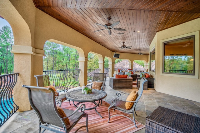 exterior space with outdoor lounge area and ceiling fan