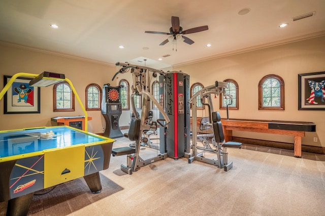 game room featuring carpet, ceiling fan, and ornamental molding