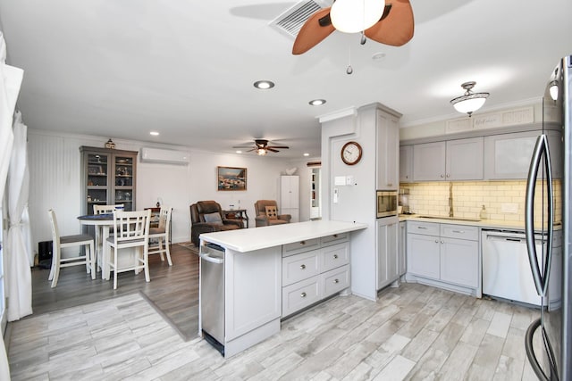 kitchen with dishwasher, ornamental molding, gray cabinets, and kitchen peninsula