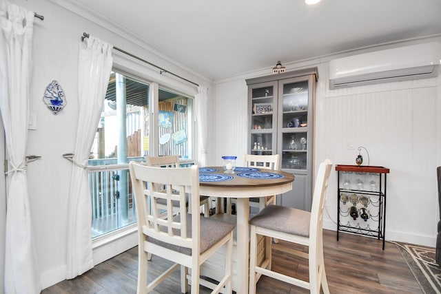 dining room with dark hardwood / wood-style flooring, crown molding, and a wall mounted AC