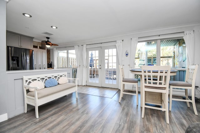 dining space featuring ornamental molding, dark hardwood / wood-style floors, and french doors