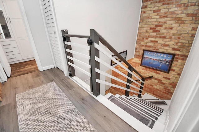 staircase with wood-type flooring