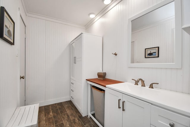 bathroom featuring vanity and ornamental molding