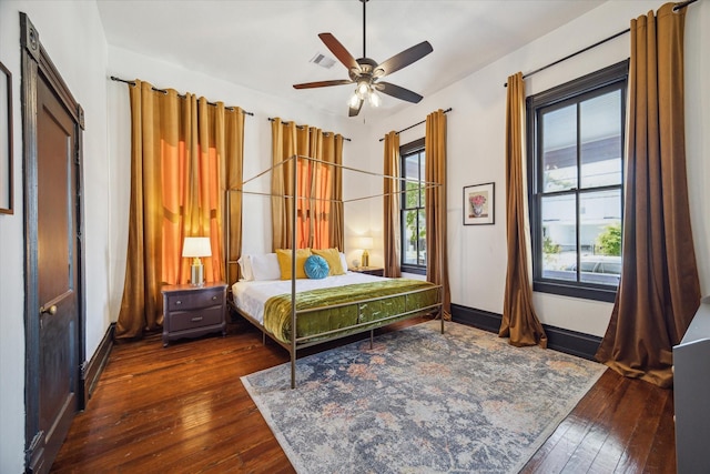 bedroom featuring ceiling fan and dark hardwood / wood-style floors