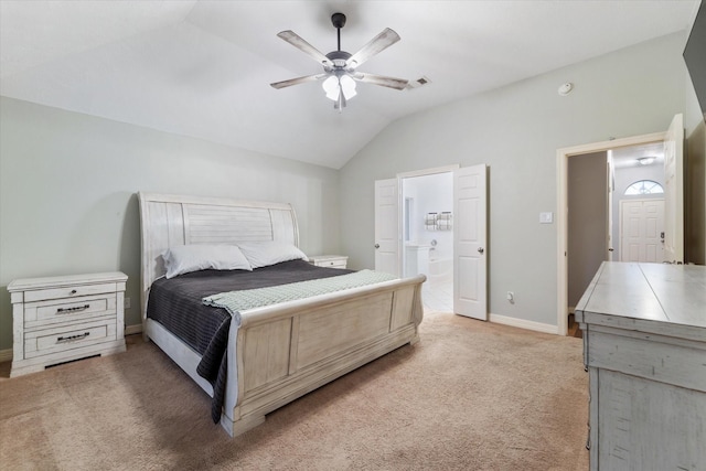 carpeted bedroom featuring connected bathroom, vaulted ceiling, and ceiling fan