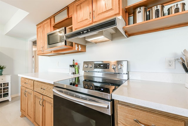 kitchen featuring light stone countertops and appliances with stainless steel finishes