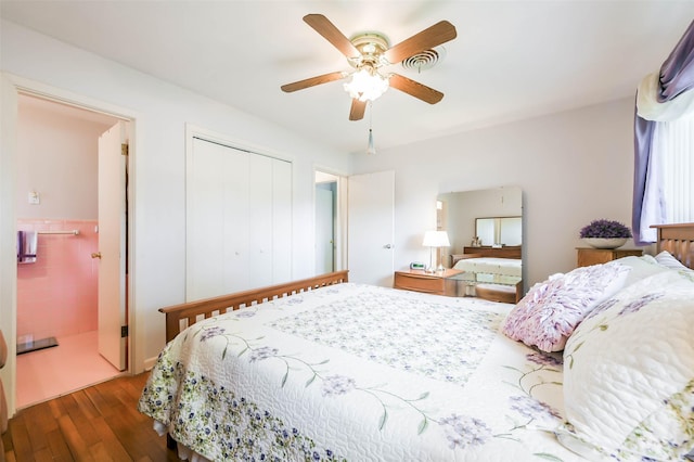 bedroom featuring ceiling fan, dark wood-type flooring, and a closet