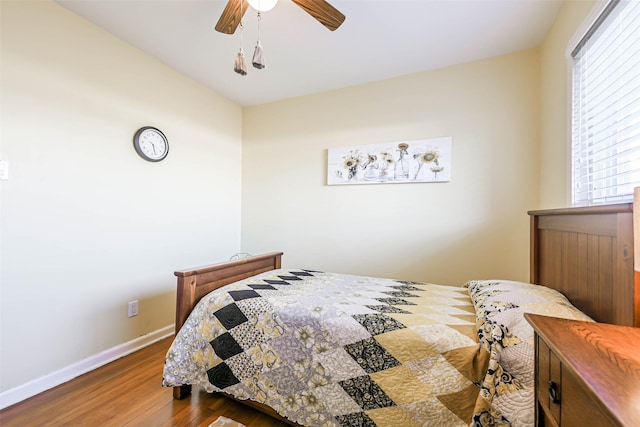 bedroom featuring dark hardwood / wood-style floors and ceiling fan