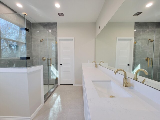 bathroom with vanity and an enclosed shower