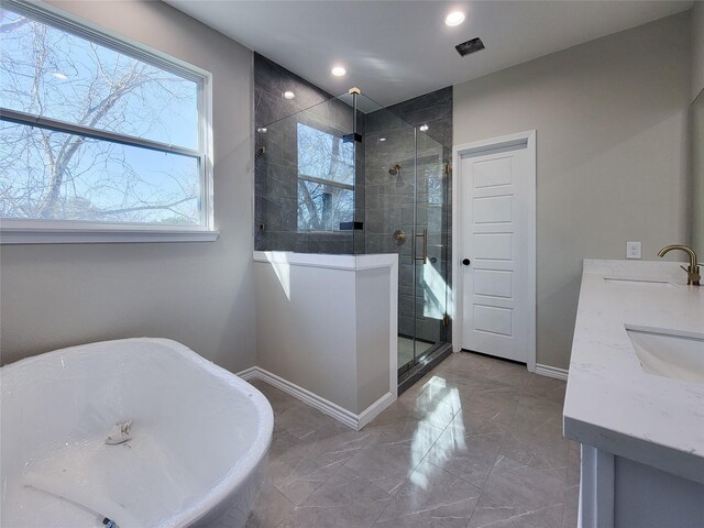 bathroom with vanity and plus walk in shower