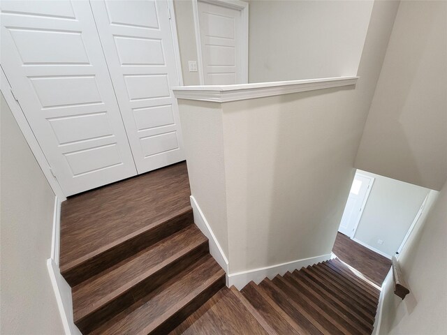 stairs with wood-type flooring