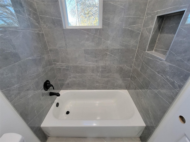 bathroom with shower / bath combination