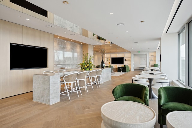 dining area with light parquet flooring