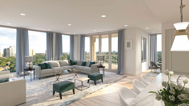 living room featuring light hardwood / wood-style flooring and a wall of windows