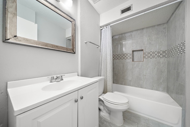 full bathroom with vanity, toilet, a textured ceiling, and shower / bathtub combination with curtain