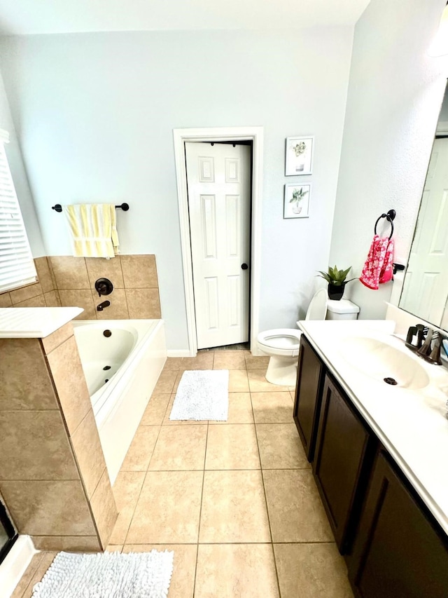 bathroom with a bathing tub, tile patterned flooring, vanity, and toilet