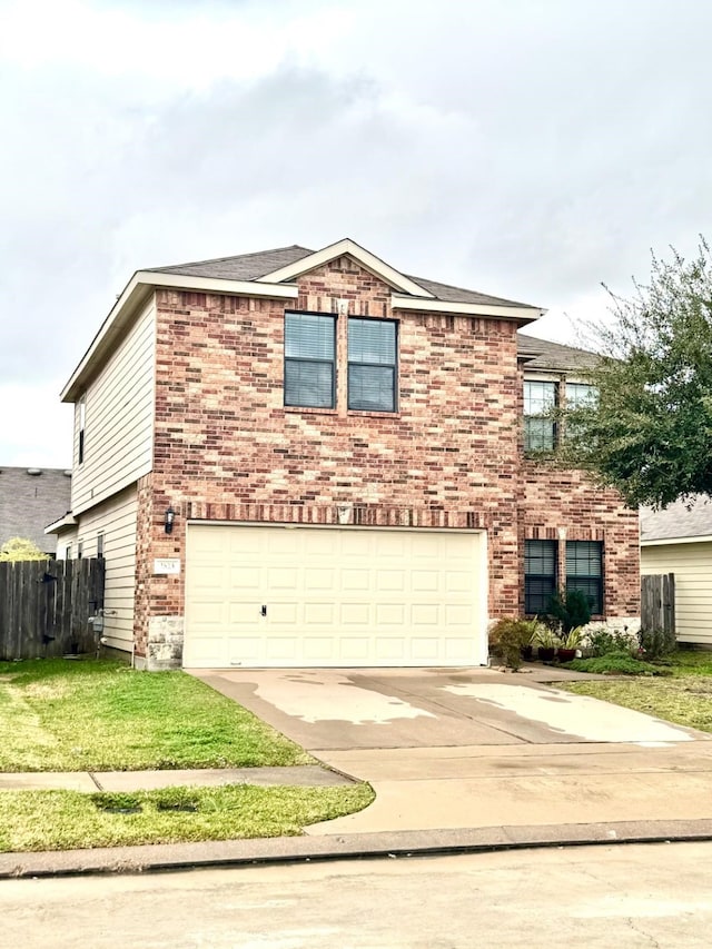 view of front facade featuring a garage and a front lawn