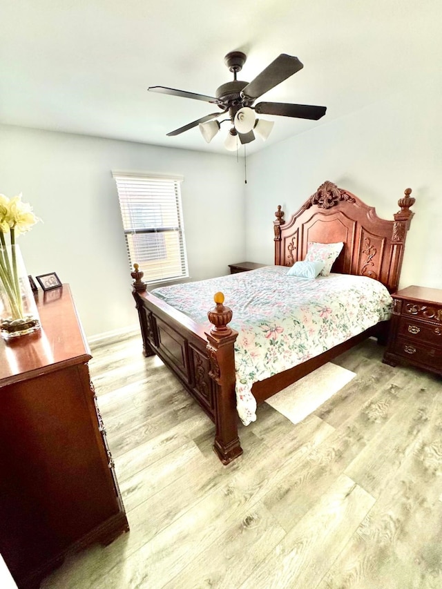 bedroom featuring ceiling fan and light hardwood / wood-style floors