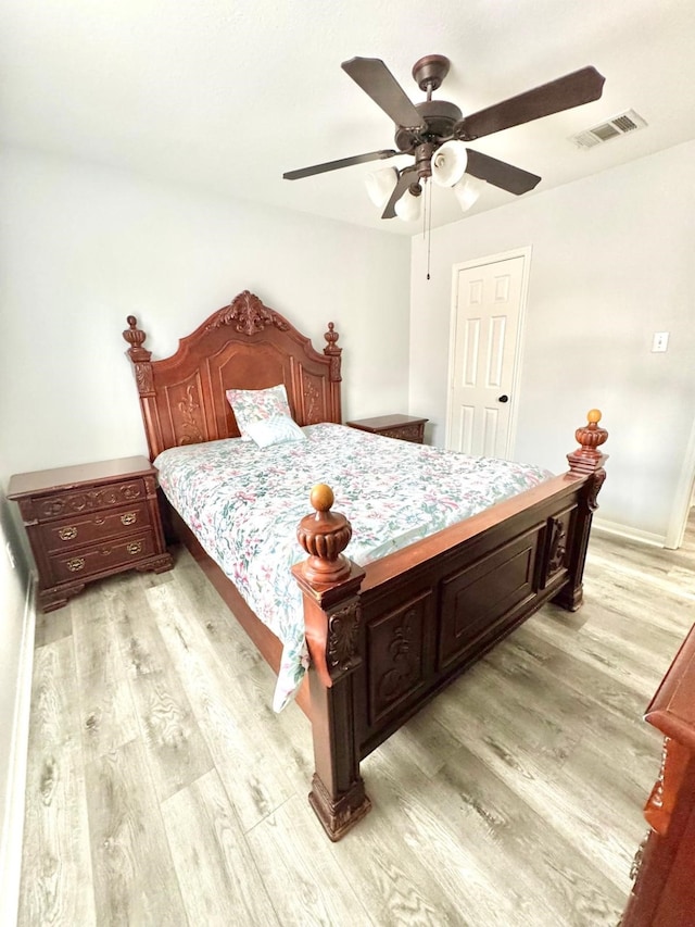 bedroom featuring ceiling fan and light hardwood / wood-style floors