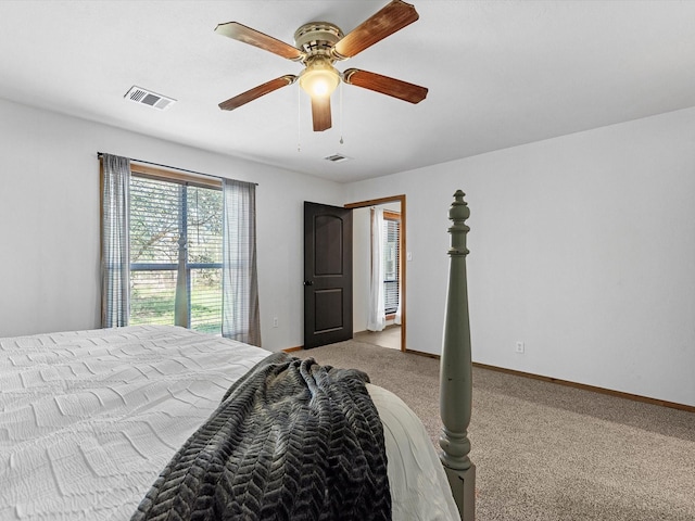 bedroom with ceiling fan and light carpet