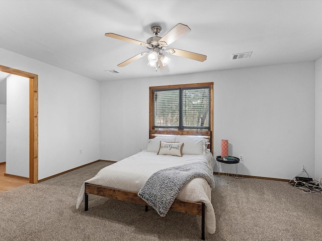 carpeted bedroom with ceiling fan