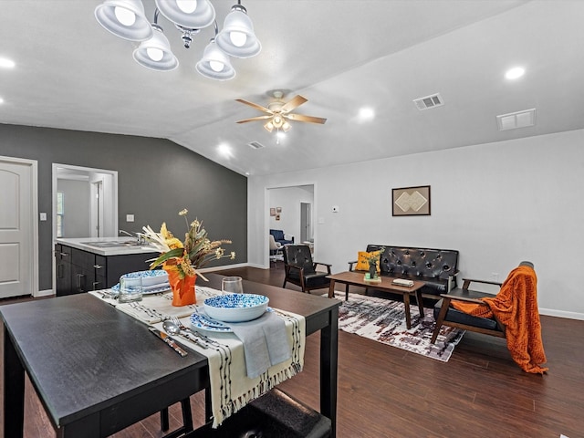 dining area with ceiling fan, dark hardwood / wood-style flooring, lofted ceiling, and sink