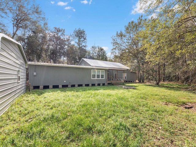 back of house featuring a yard