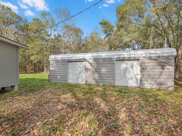 view of outdoor structure with a lawn