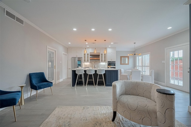 4 Rutgers Pl W, University Place, TX 77005 - living room with crown molding, a chandelier, baseboards, light wood-style flooring, and recessed lighting