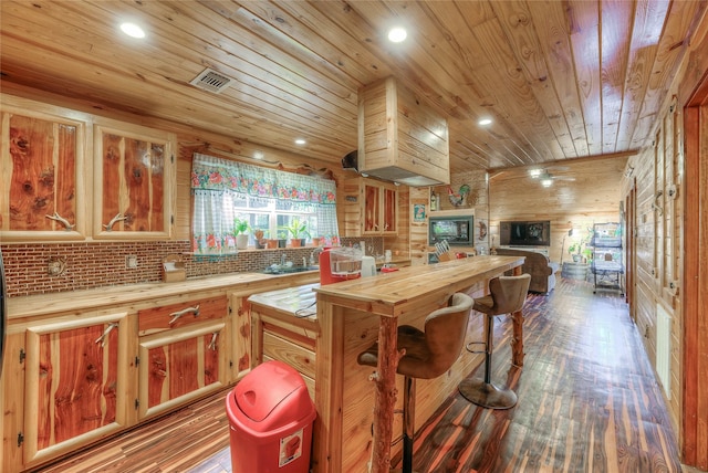 kitchen with backsplash, hardwood / wood-style floors, and wood ceiling