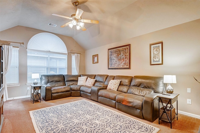 living room featuring light colored carpet, ceiling fan, and lofted ceiling