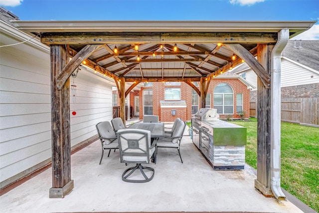 view of patio featuring a gazebo, an outdoor kitchen, and area for grilling