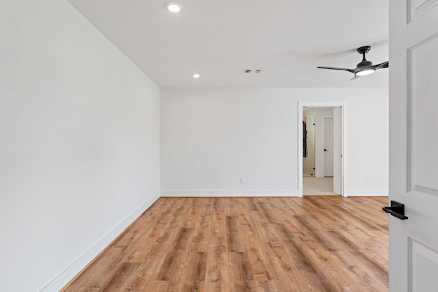 spare room featuring ceiling fan and light wood-type flooring