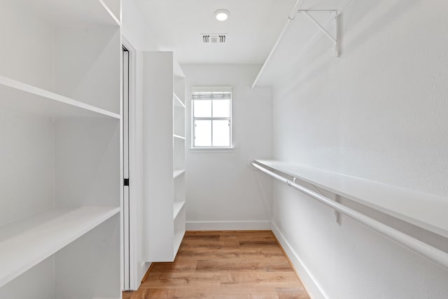 spacious closet with wood-type flooring