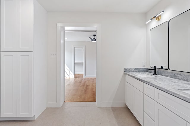 bathroom featuring ceiling fan, tile patterned flooring, and vanity