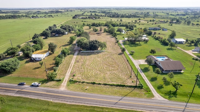 birds eye view of property featuring a rural view